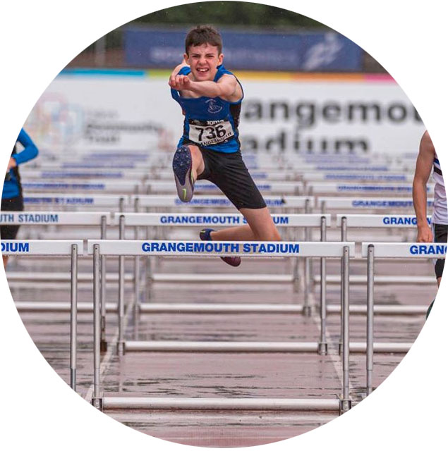 Boys competing in hurdles event